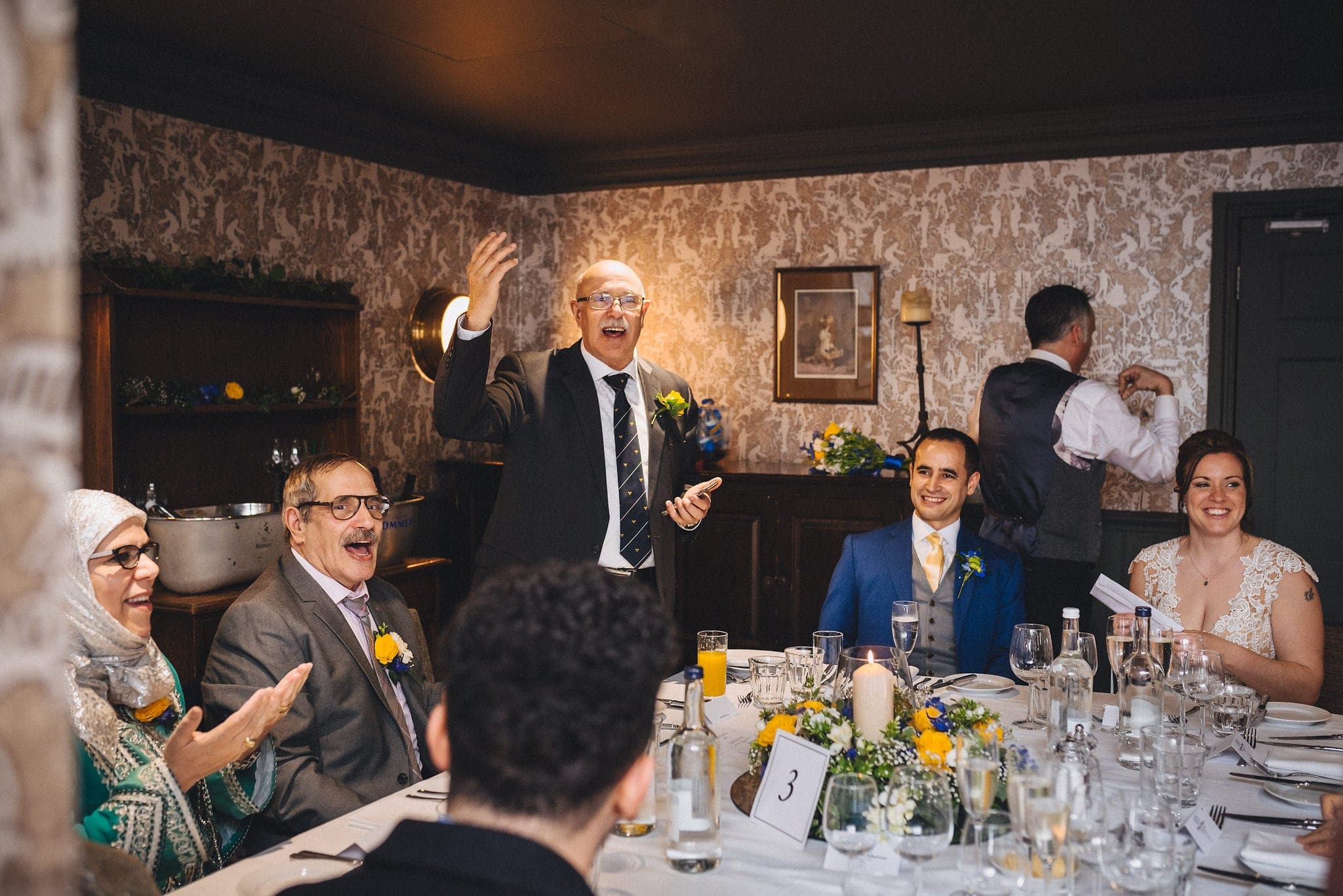 Father of the groom gives speech at wedding reception