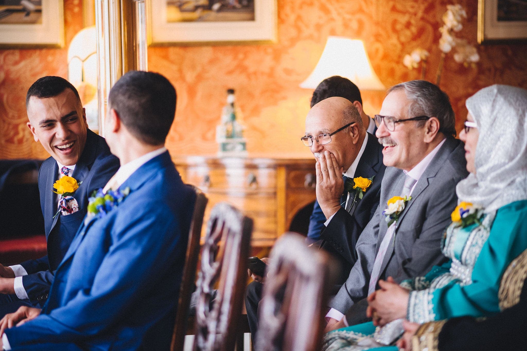 guests laugh together at wedding ceremony in Brighton Royal Pavilion