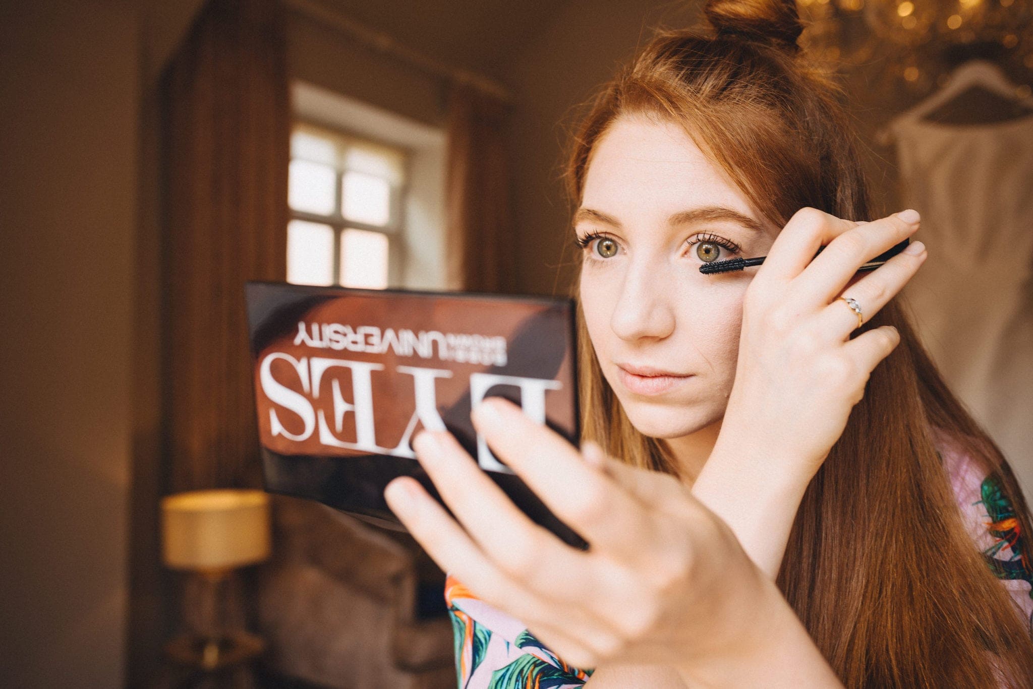 Bride putting on mascara