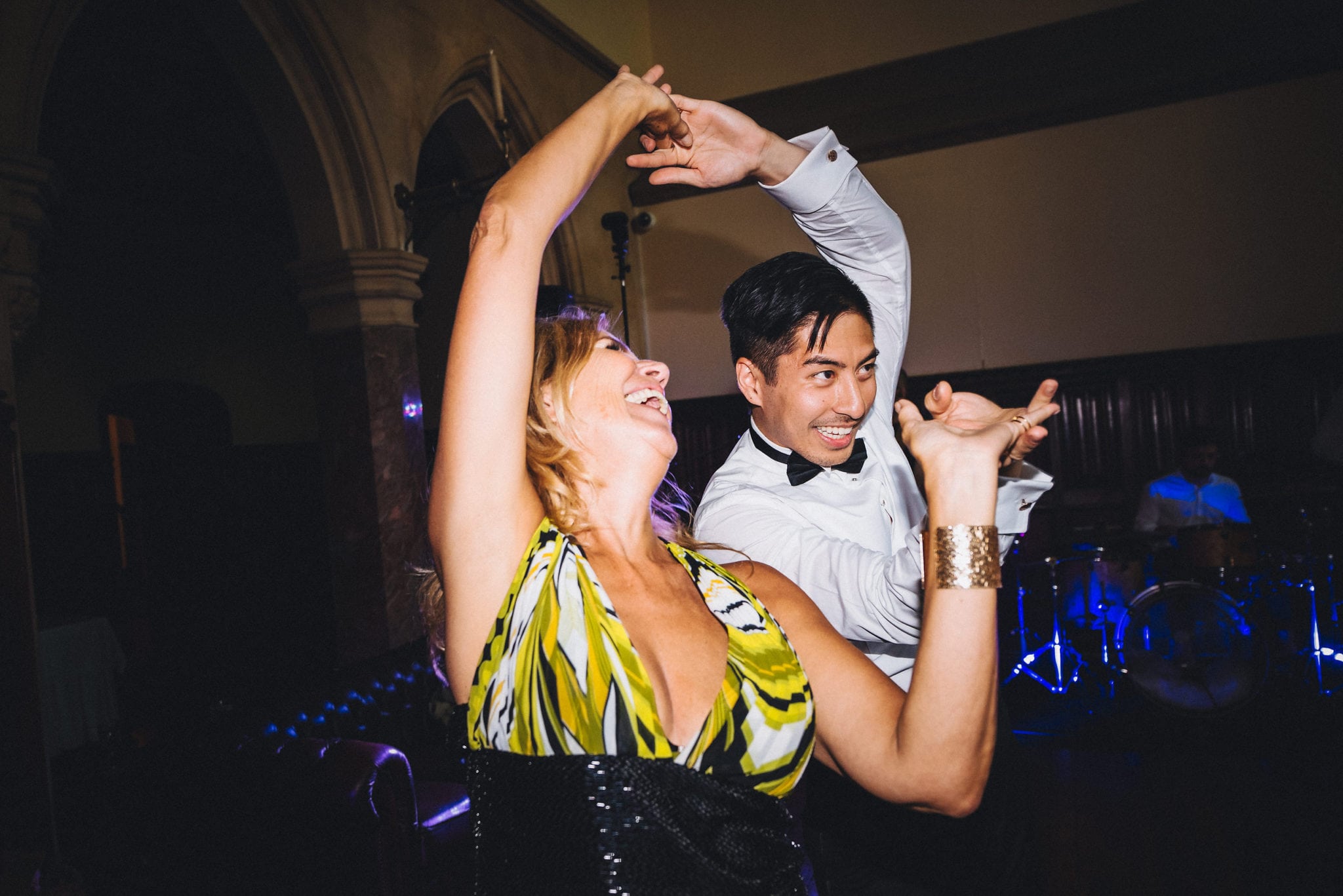 Guests twirl each other on dance floor