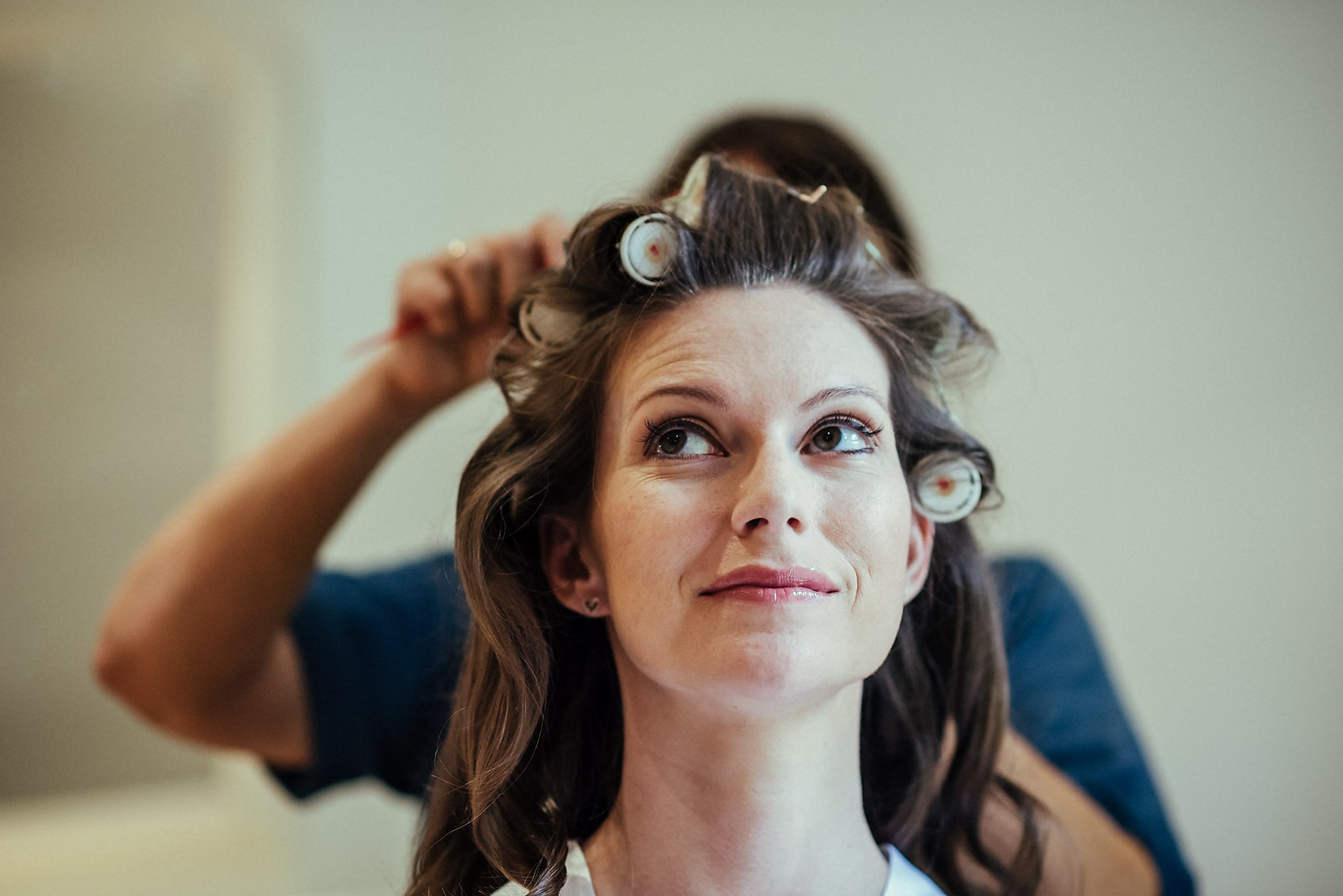 Bride getting her hair styled