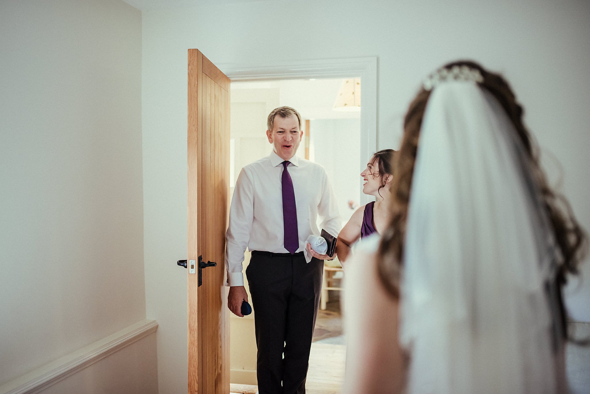 Father of the bride sees his daughter in her dress for the first time