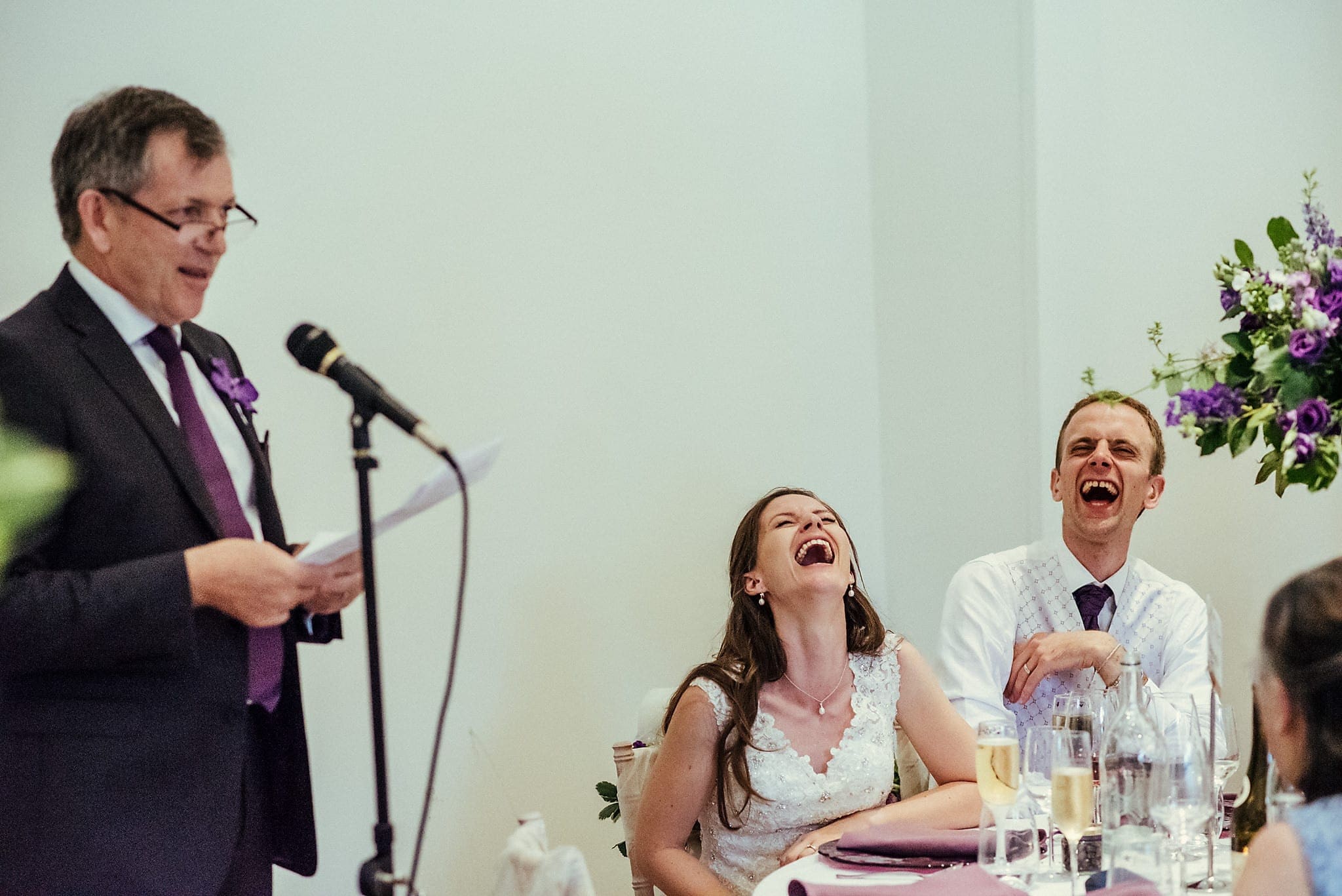 Bride and Groom laughing out loud at their Lovely and Lively Dorney Court Tipi Wedding