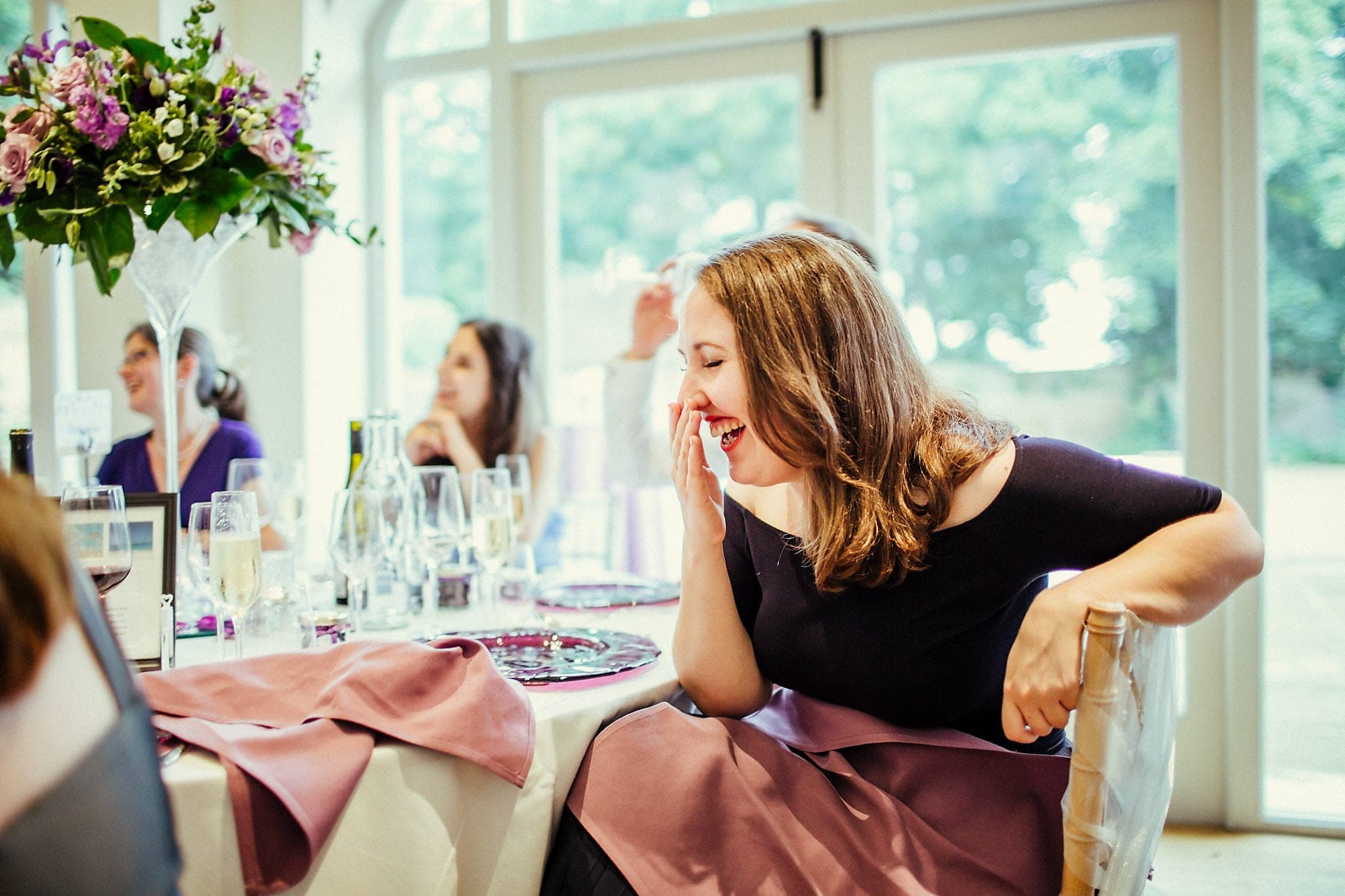 Guest laughs during wedding speeches