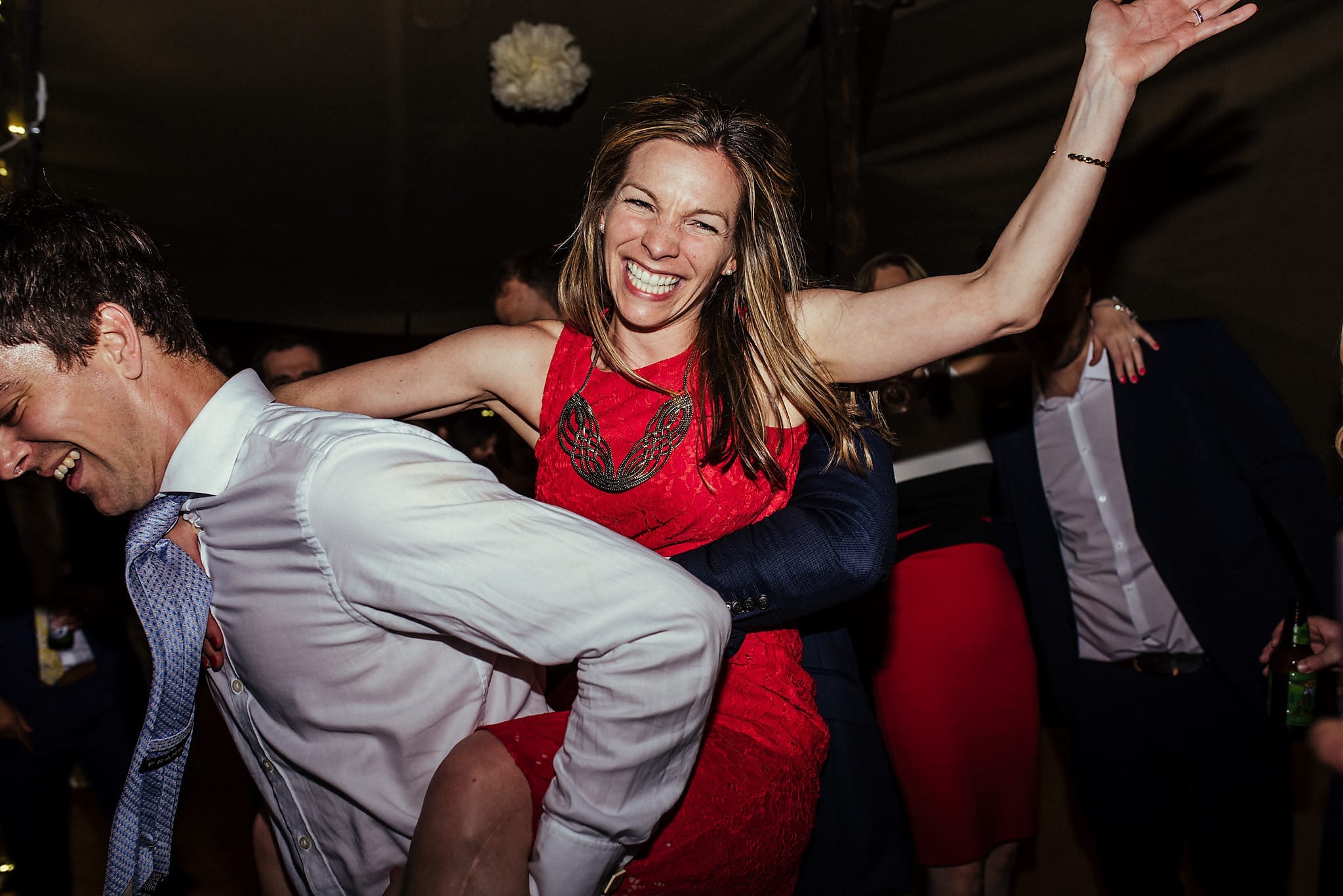 Wedding guests dancing in a tipi