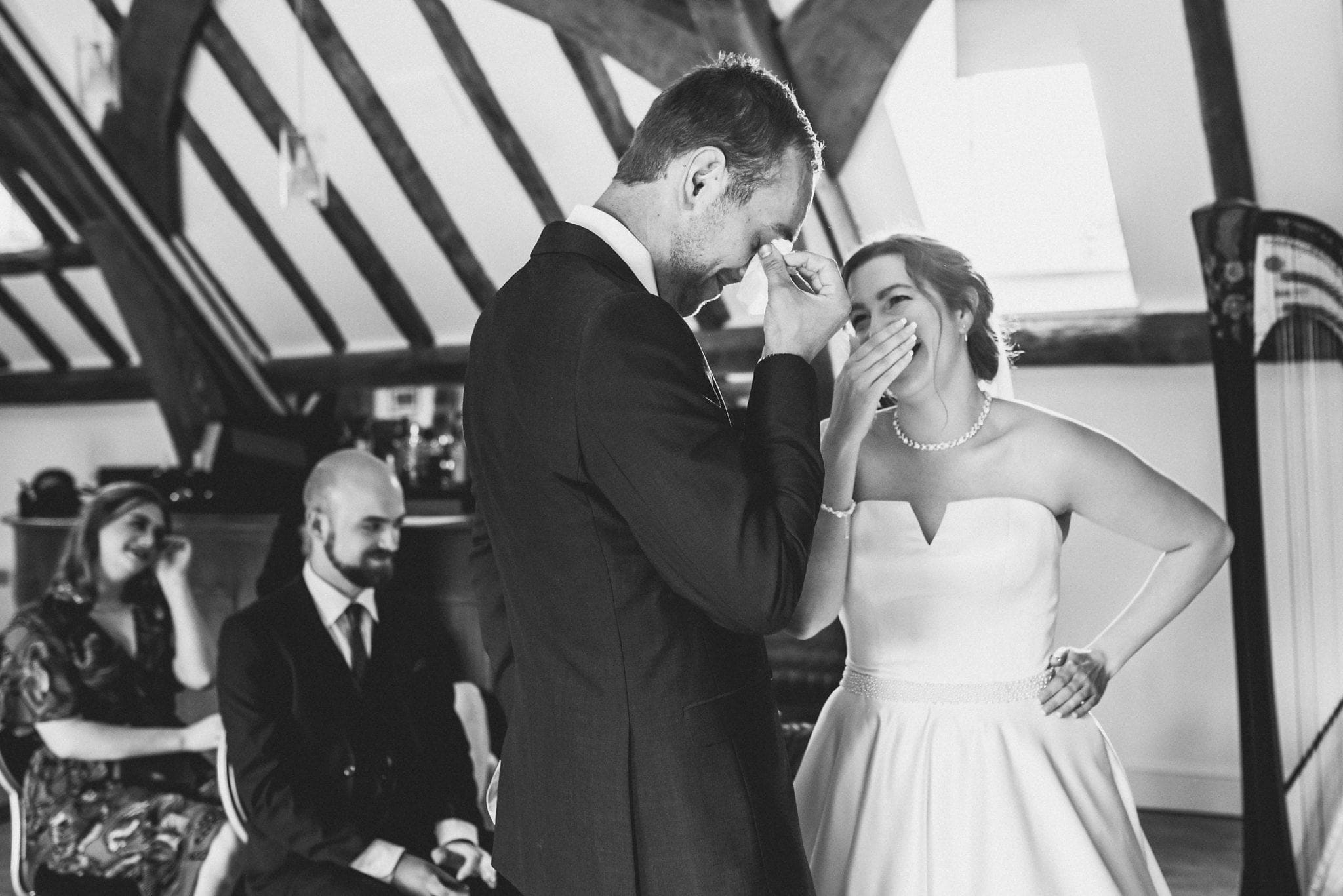 Bride laughs and groom gets emotional during wedding ceremony