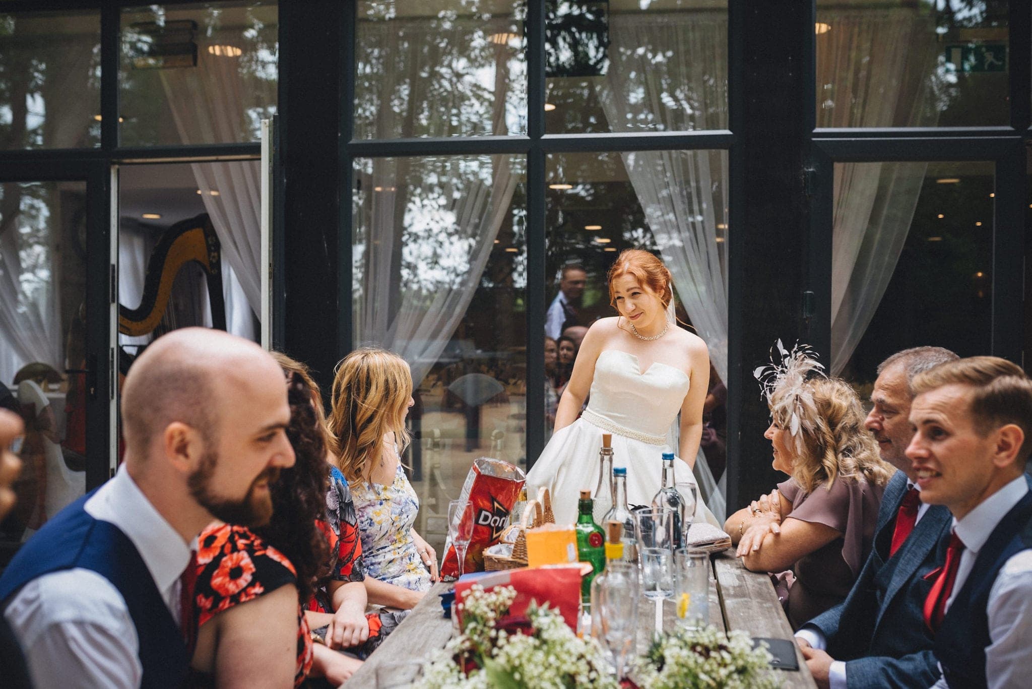 Bride chatting to her guests at the Hever Hotel