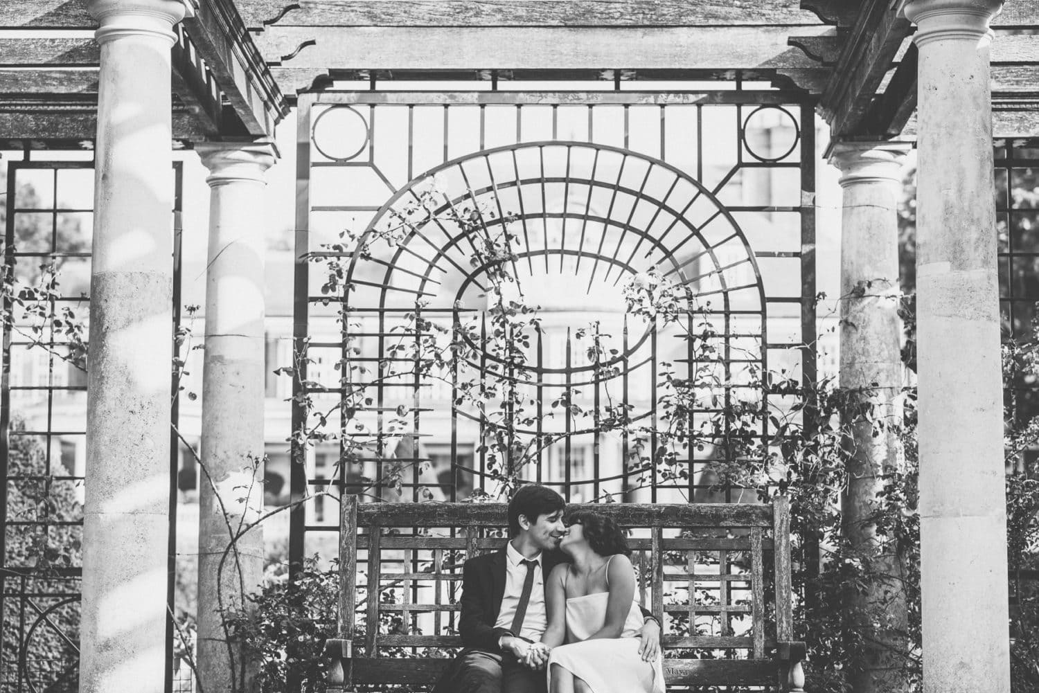 Bride and groom kiss at the Hampstead hill garden and pergola