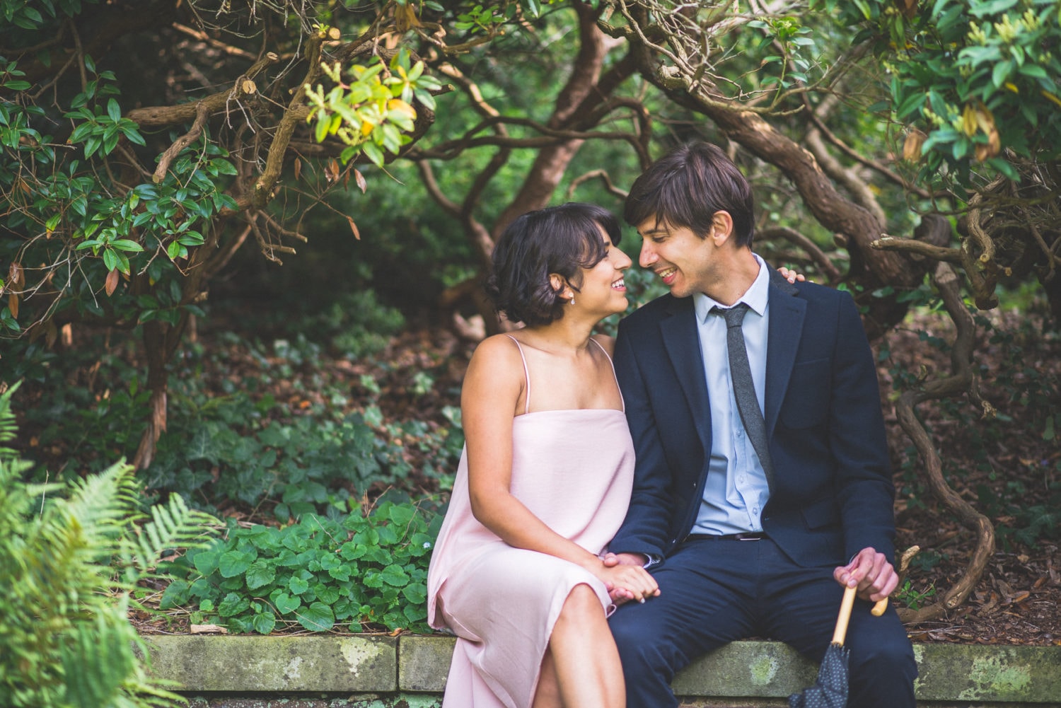 engaged couple laughing at their unposed Hampstead Heath Pre-wedding shoot