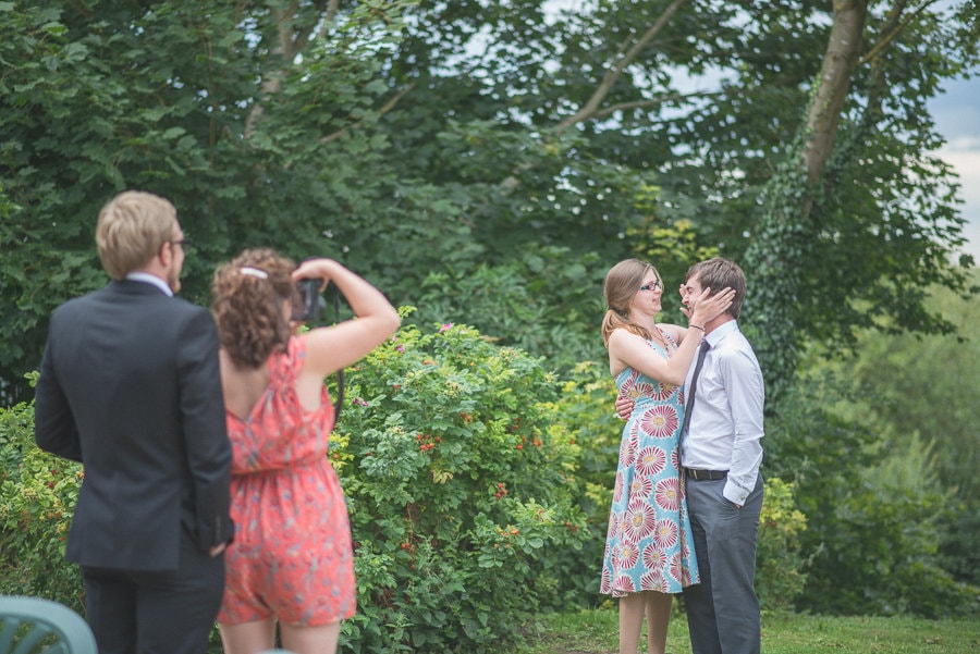 wedding guests taking photos of each other