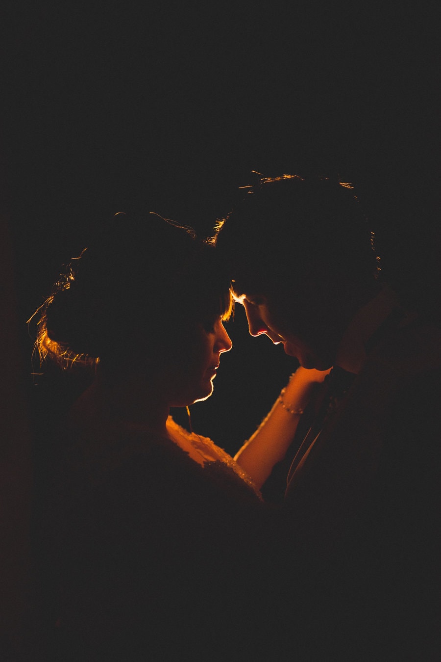 Bride and groom silhouette at their summer rustic Kent barn wedding