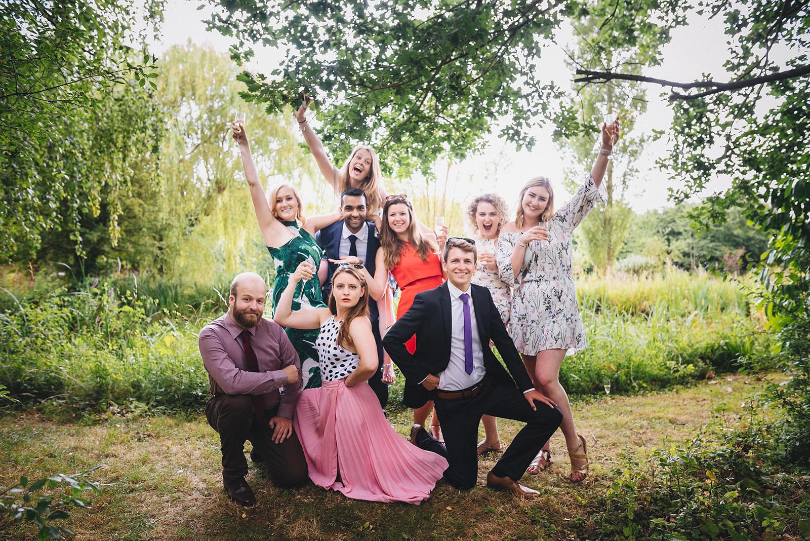 unposed fun natural wedding group shot