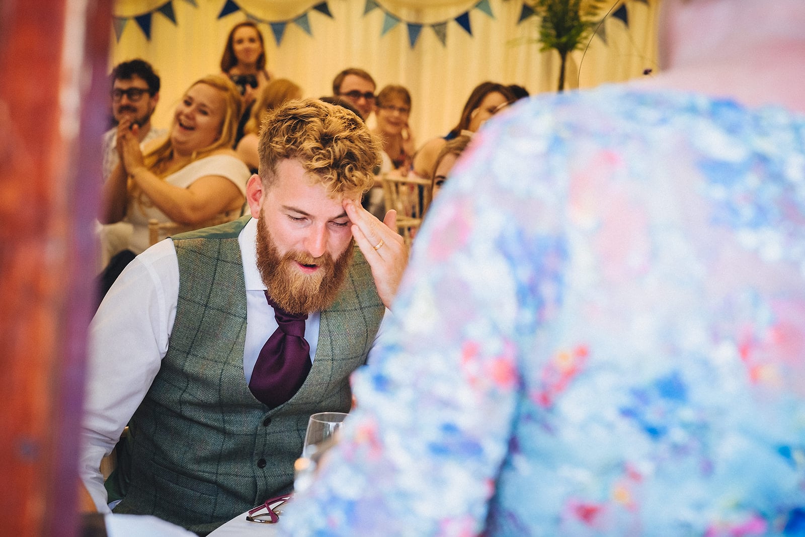 Groom pulling an embarrassed face during his mums speech