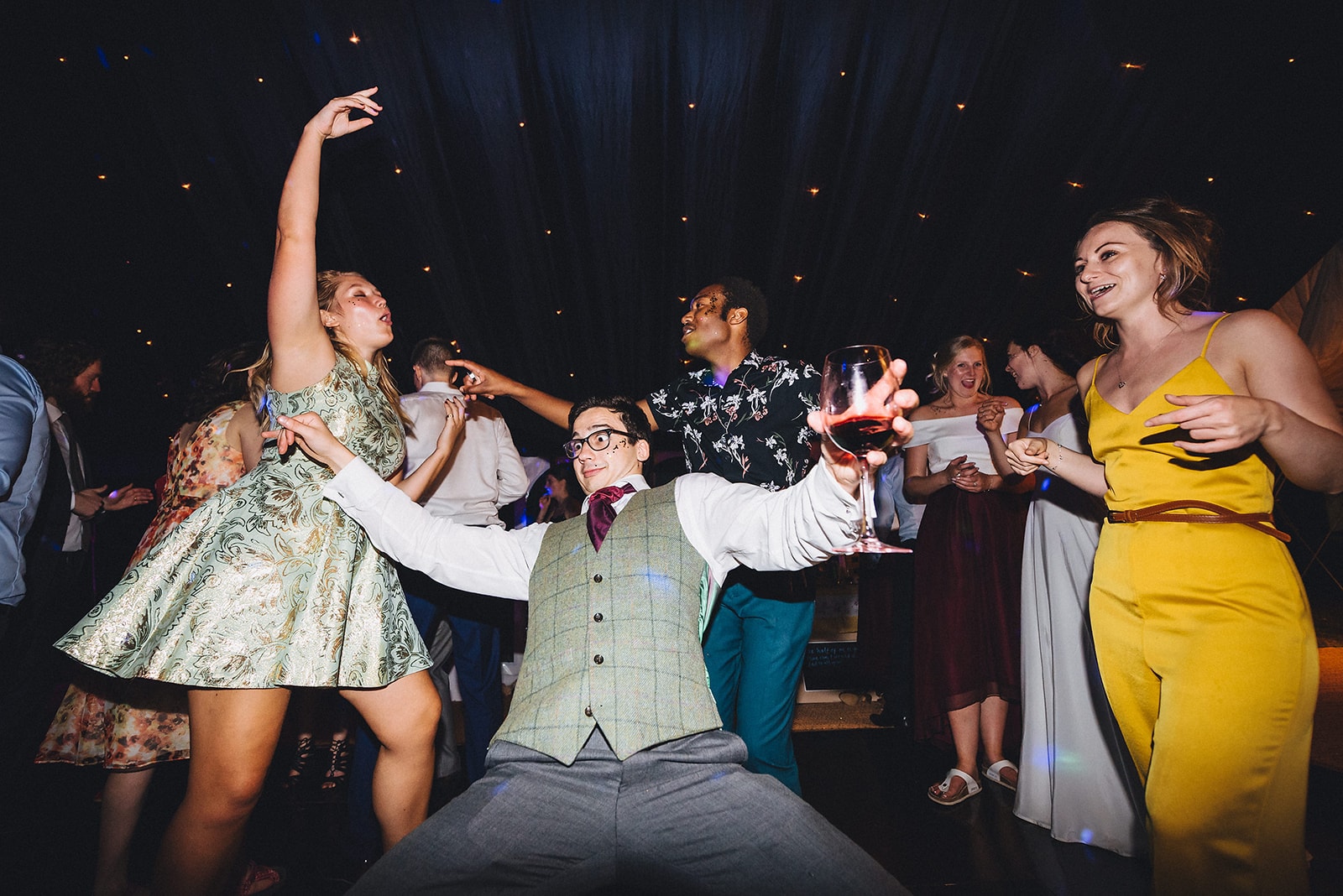 Wedding guests dancing at a cambridge farm marquee wedding