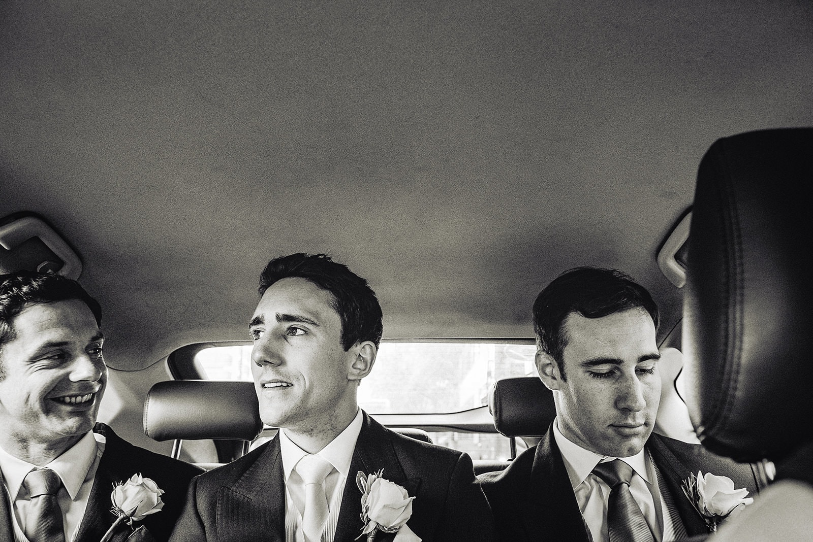 Groom travelling to his Hurlingham Club wedding with his groomsmen