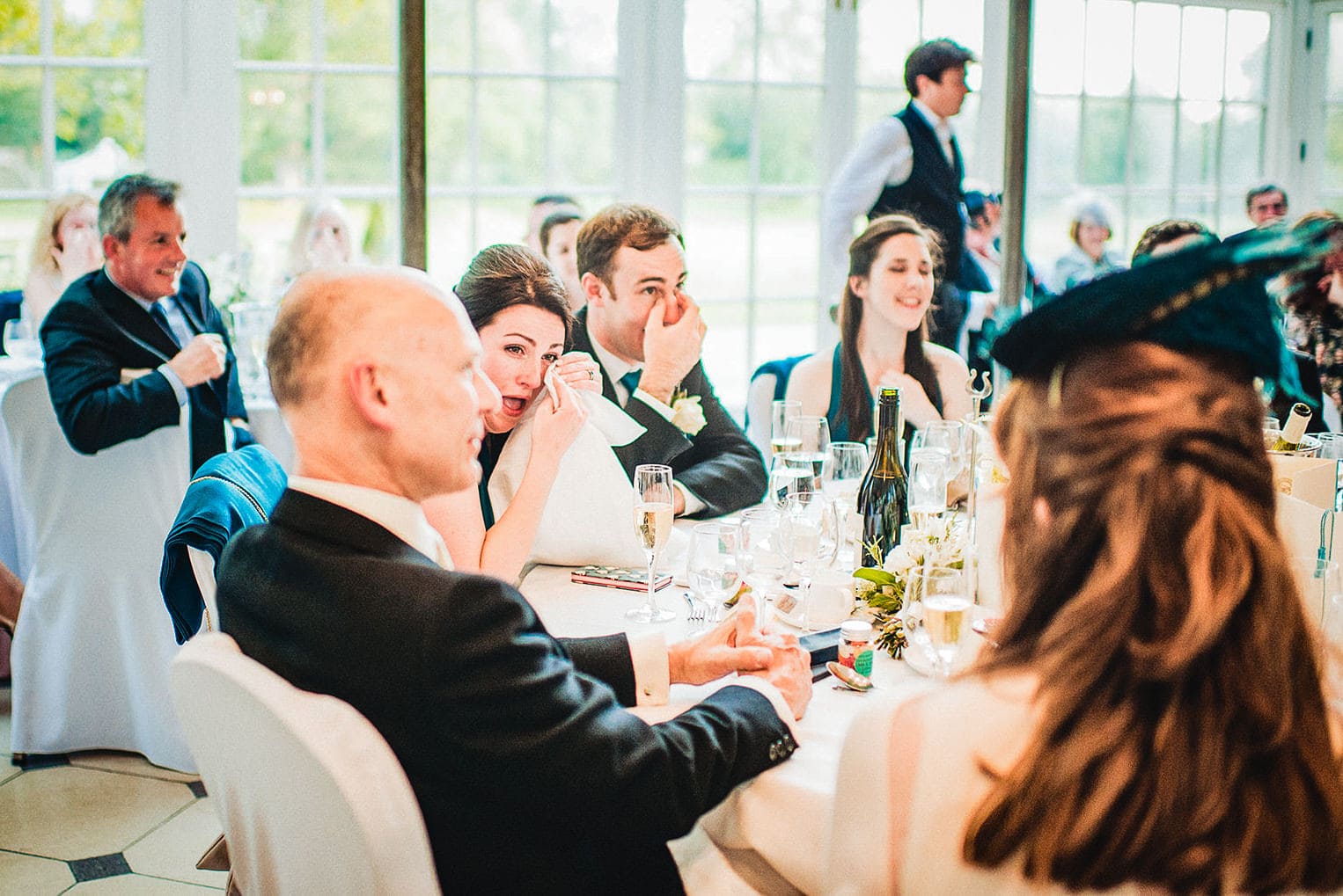 Wedding guests wipe tears in the Terrace Room at the Hurlingham Club