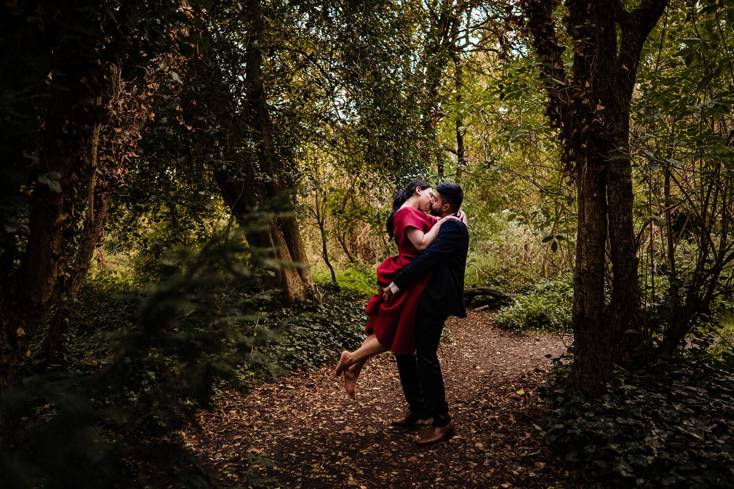 Bride and Groom kiss in the Gardens at London's Hampstead Pergola