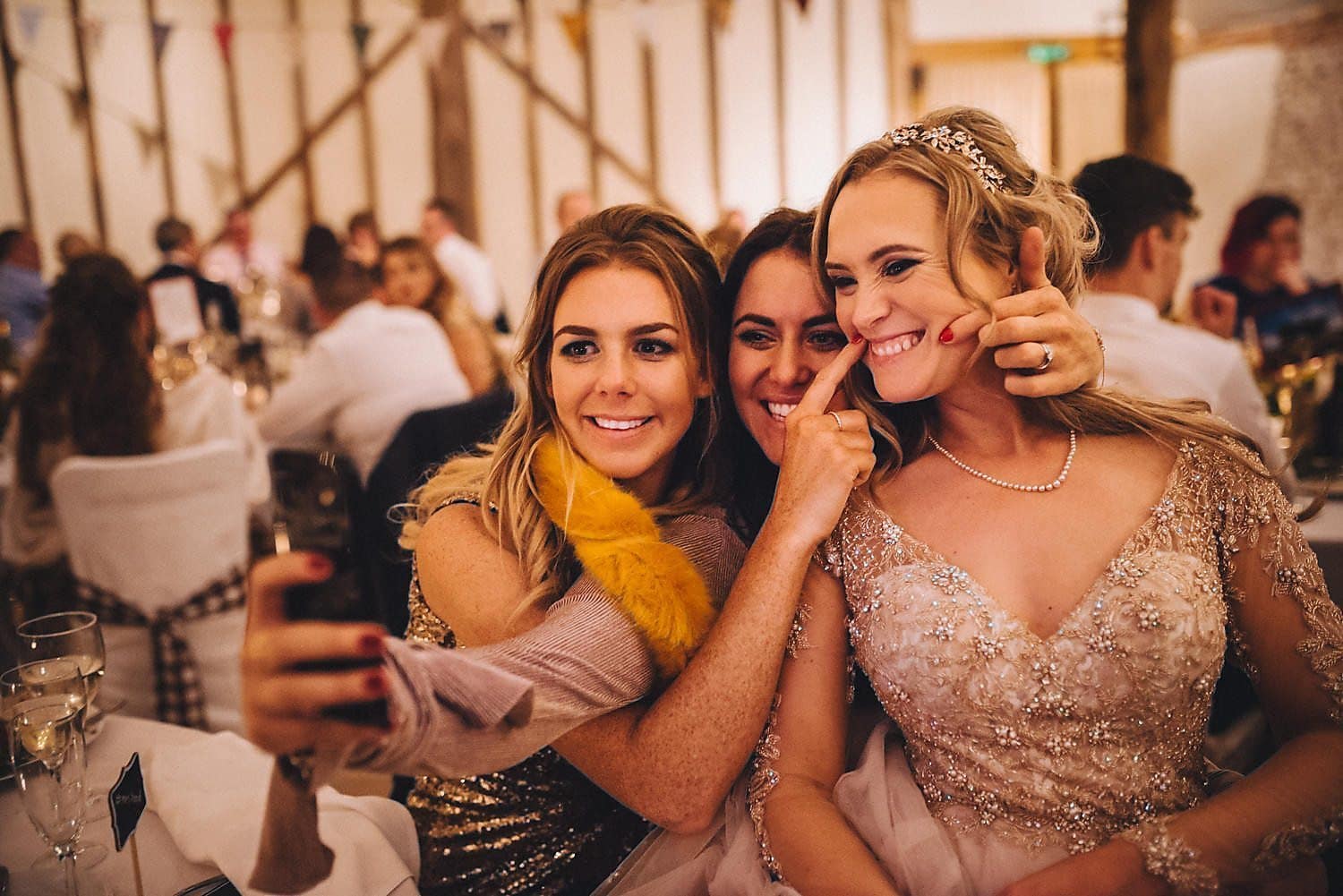 Bride taking selfie with her Upwaltham Barns wedding guests