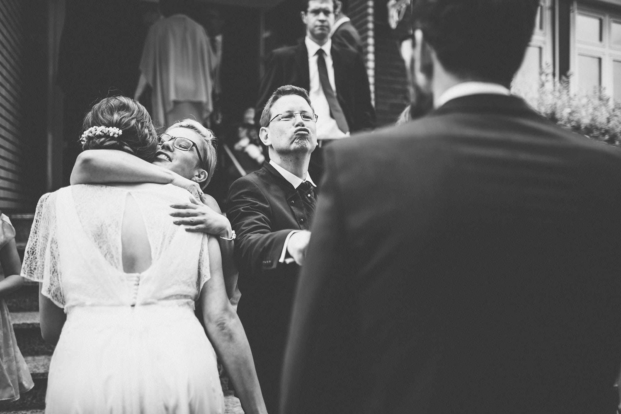 Documentary Wedding Photography by Maria Assia Photography of the bride and groom greeting their wedding guests