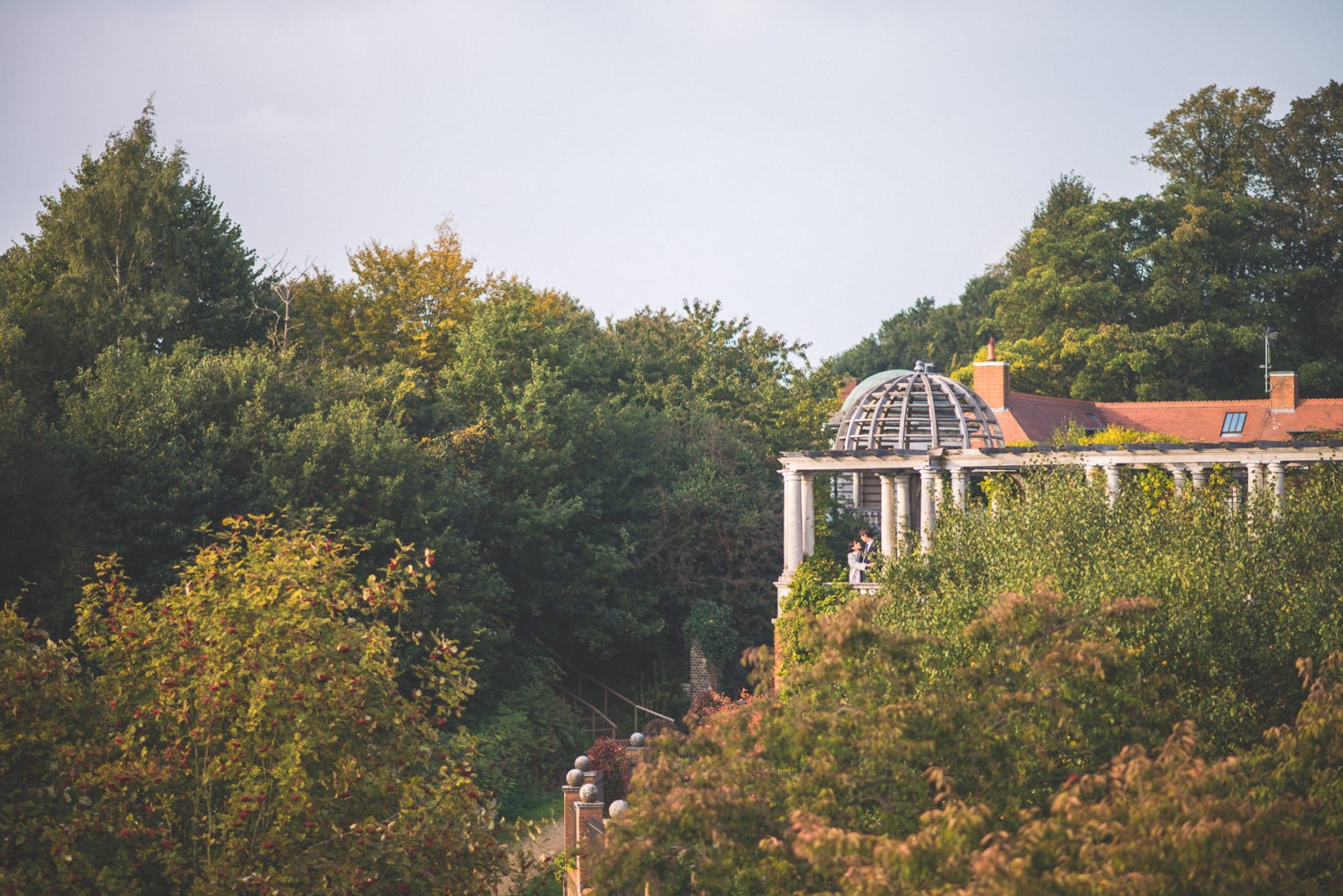 A couple standing in the luxurious wedding venue Hampstead Pergola in London